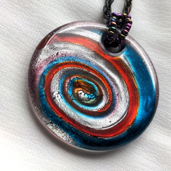 Jewelry - Iridescent spiral art glass round pendant silver red blue